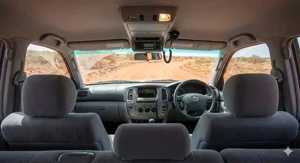 Interior view of 2005 LandCruiser 100 Series GXL Facelift with 4WD Interiors roof console installed.