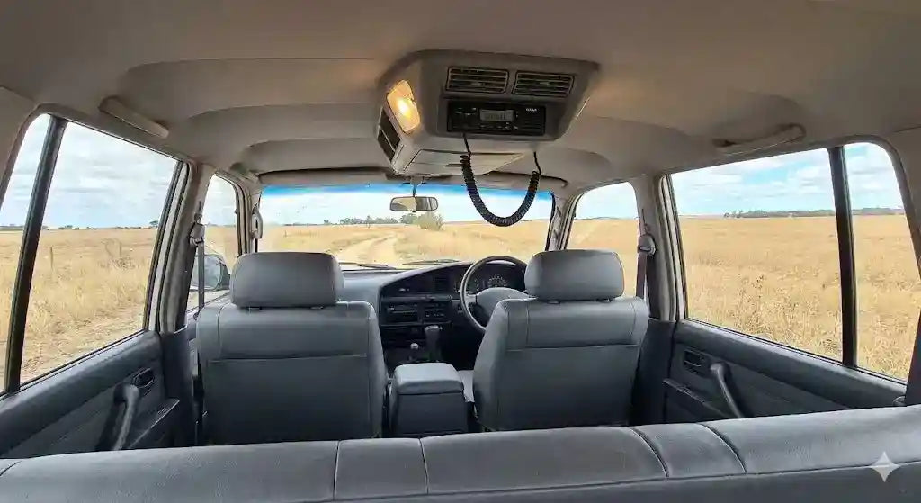 Interior view of basic 1990 LandCruiser 80 Series Standard with 4WD Interiors roof console installed.