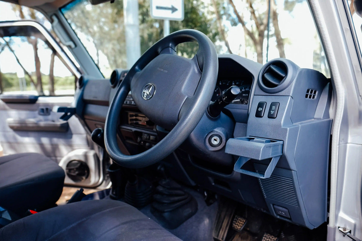Car interior with steering wheel and dashboard view