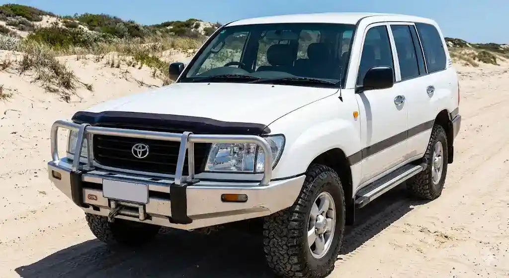 Front view of White Toyota LandCruiser 100 Series GXL with OCAM Bonnet Protector installed.