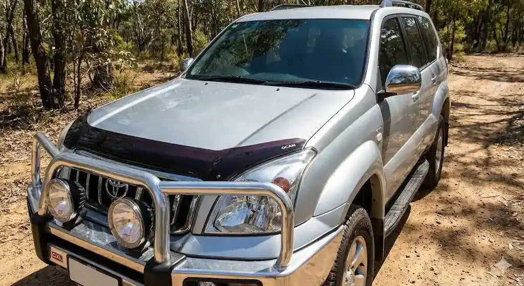 Front view of Silver Toyota Prado 120 Series GXL with OCAM Bonnet Protector installed.