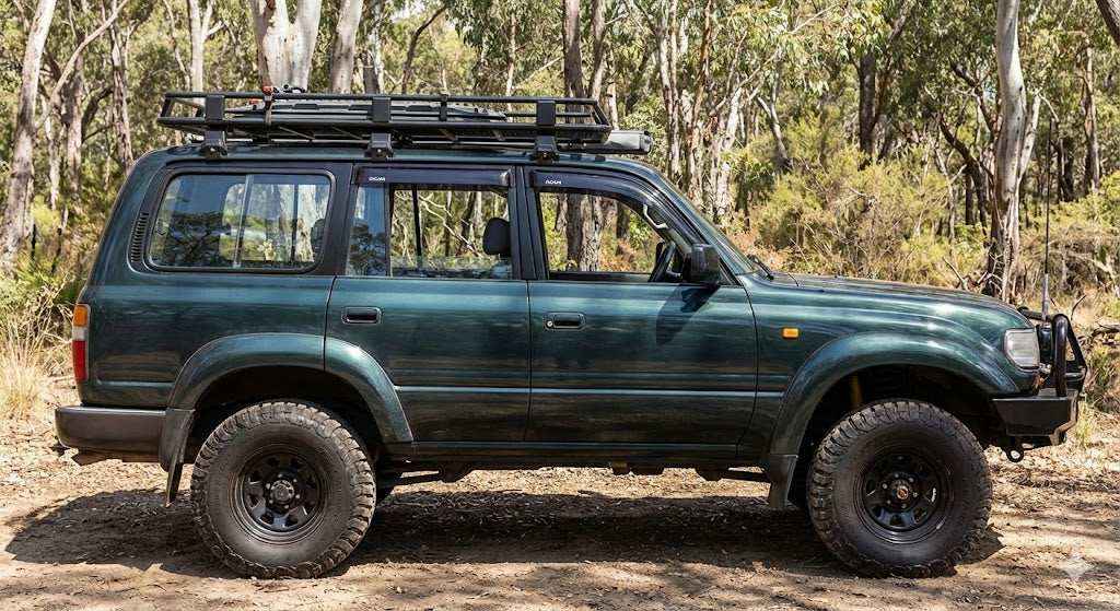 Side view of Dark Green Toyota LandCruiser 80 Series GXL with OCAM weather shields installed.
