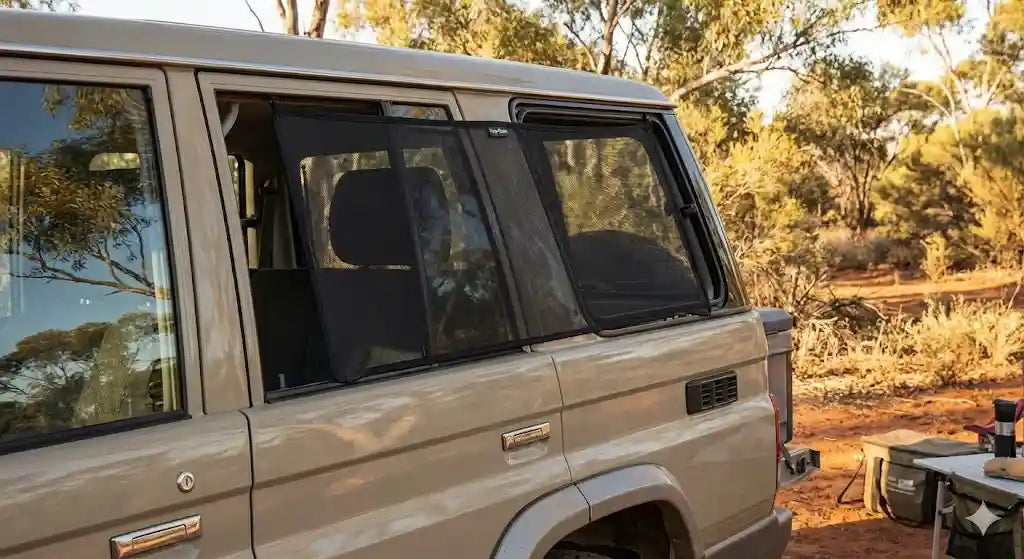 Snap Shades magnetic window shade installed on Toyota LandCruiser 76 Series Wagon rear door for camping