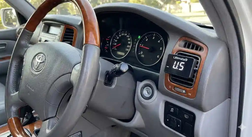 Interior view of Toyota LandCruiser 100 Series Sahara dashboard showing Ultimate9 EVC Throttle Controller.