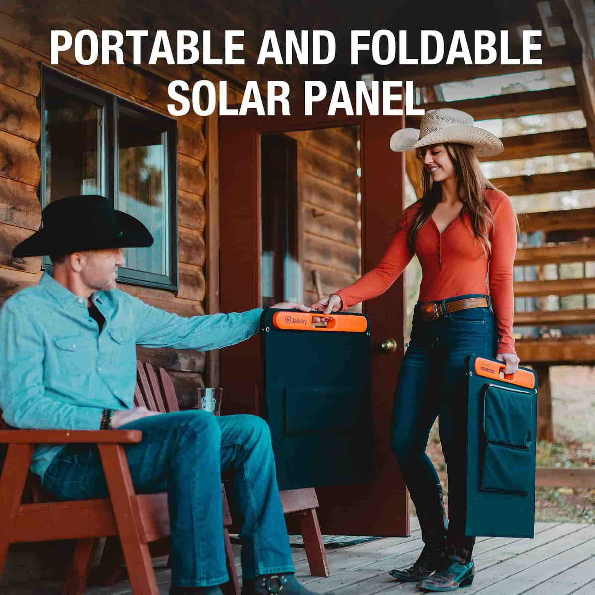 Man and woman with portable foldable solar panels in front of a wooden cabin.
