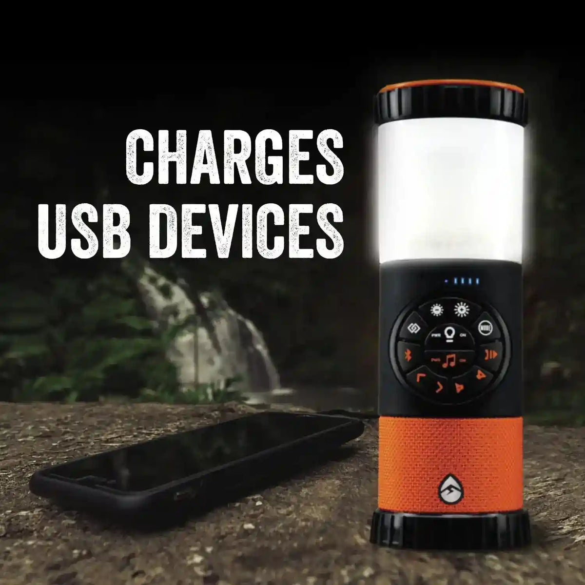 Orange and black portable lantern with USB charging capability on a natural background