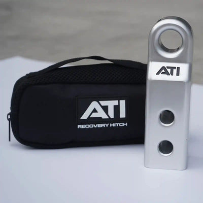 ATI recovery hitch and carrying case on a gray background
