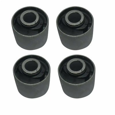 Four black cylindrical rubber bushings on a white background