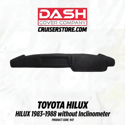 Black car dashboard cover for Toyota Hilux on a white background with Dash Cover Company branding.