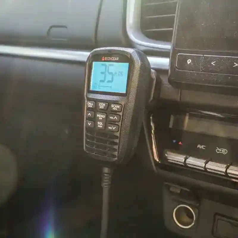 Car radio with digital display showing '35' inside a vehicle.