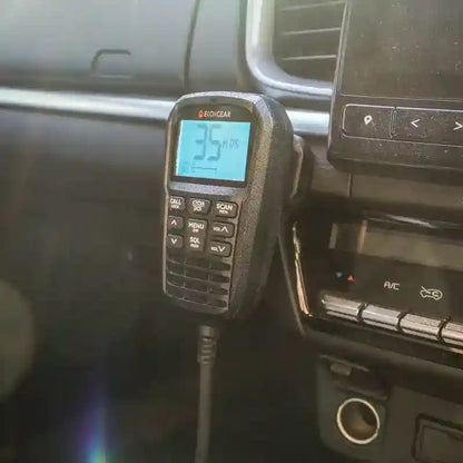 Car radio with digital display showing '35' inside a vehicle.