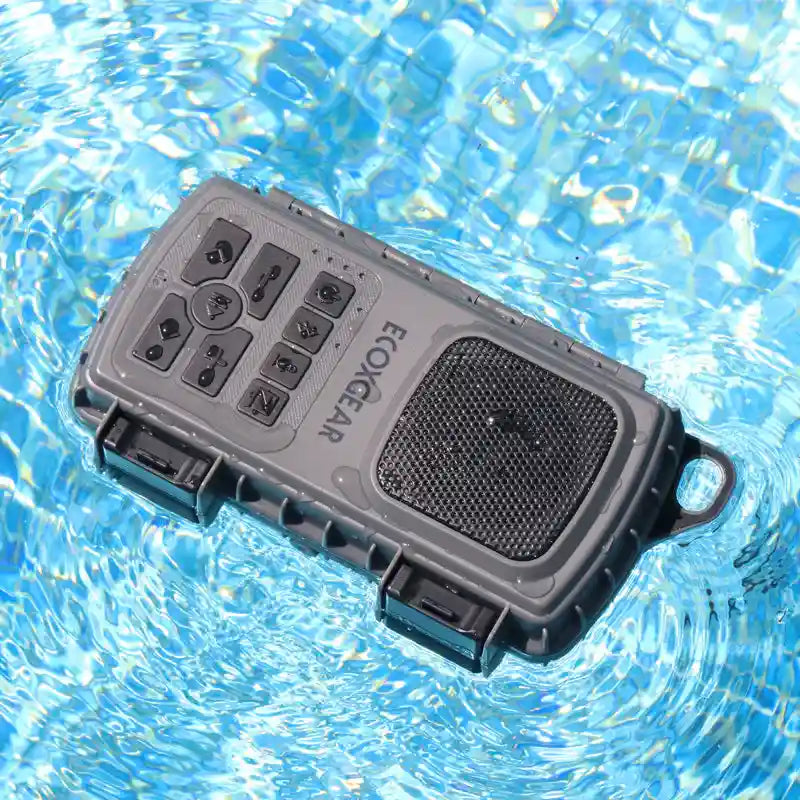 Portable speaker floating on water with 'EcoGear' branding