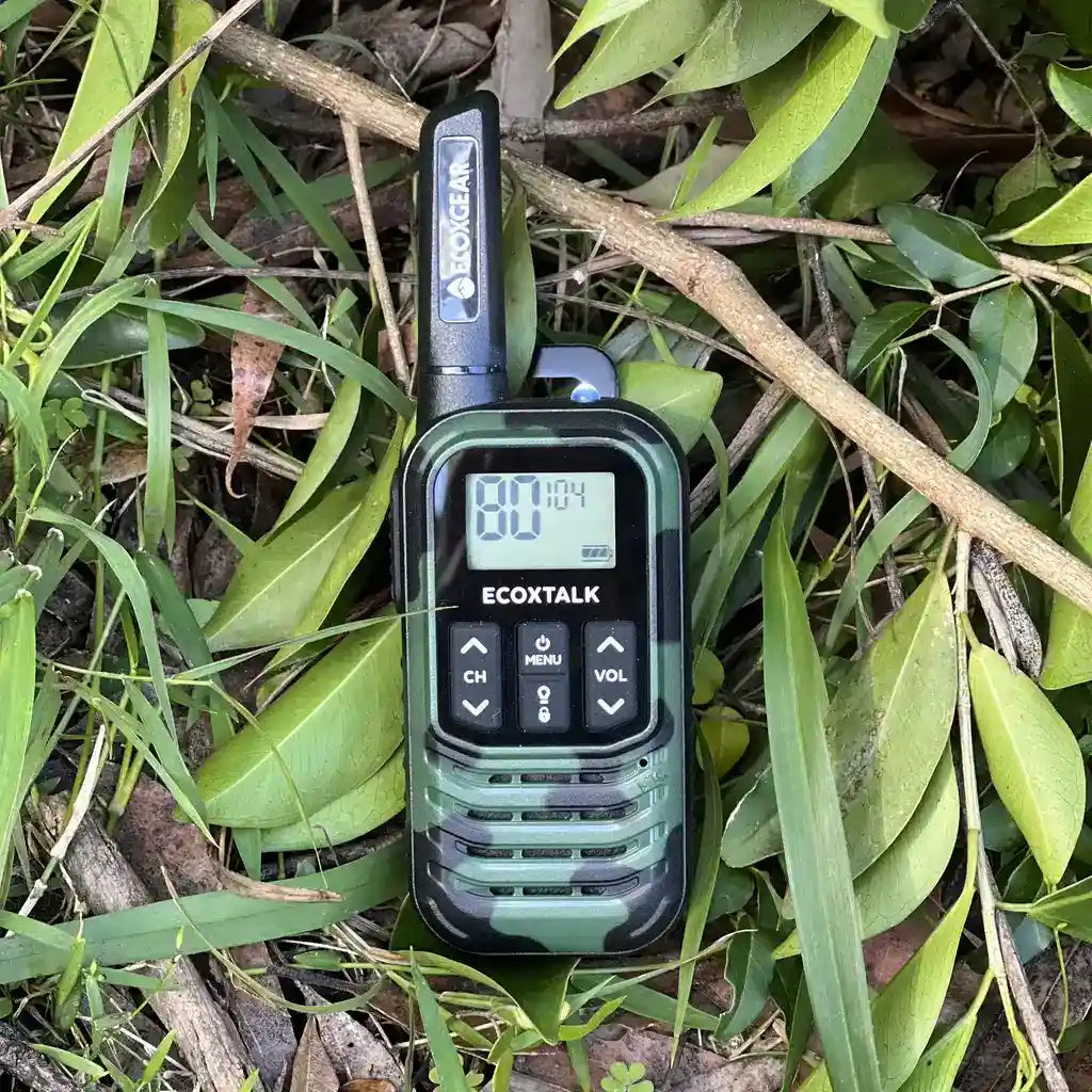 Walkie talkie with camouflage design on a leafy background