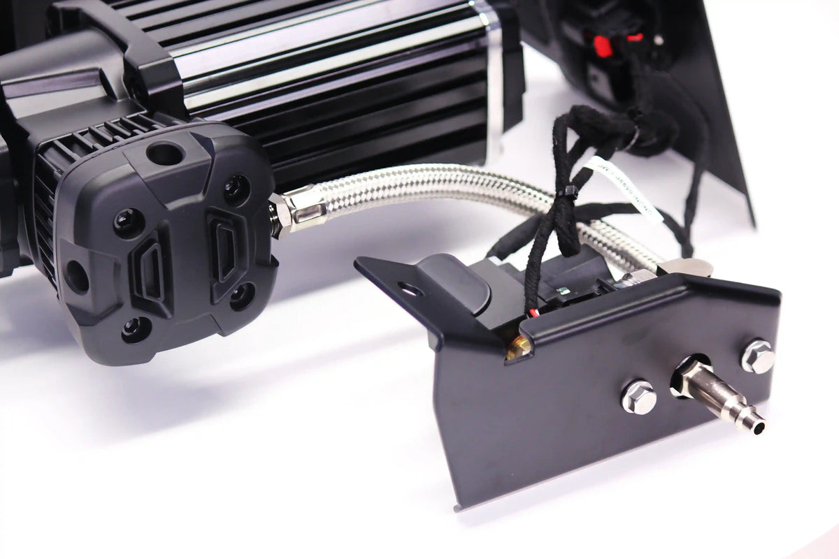 Close-up of a tire pressure compressor on a white background