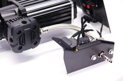 Close-up of a tire pressure compressor on a white background