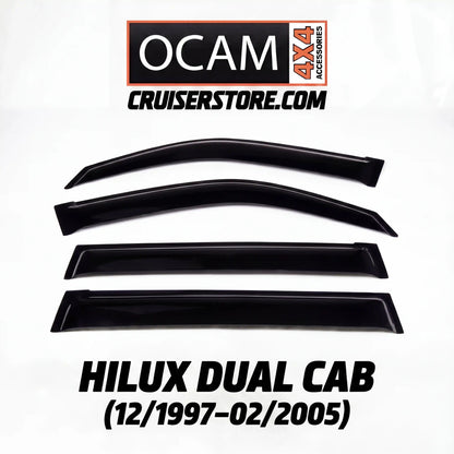 Set of black window deflectors for Hilux Dual Cab with OCAM 4x4 Accessories branding on a white background.