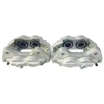 Two front brake calipers for Toyota LandCruiser 78/79 Series on a white background