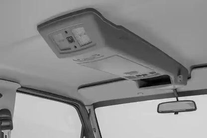 Car interior with a roof console.