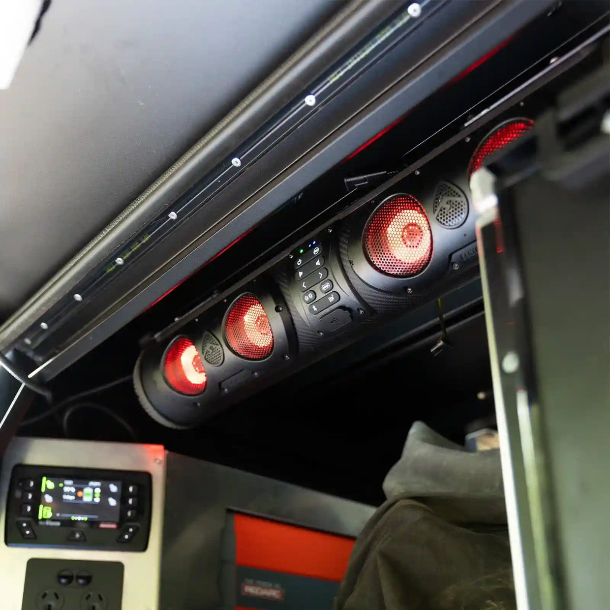 Close-up of a SoundExtreme SE26 with red lights and control panels.