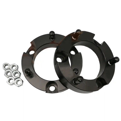 Two Coil Strut Shock Spacers with bolts and washers on a white background