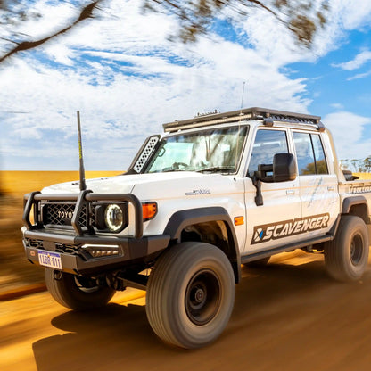 White Toyota SUV with 'Scavenger' branding on a road with blurred background
