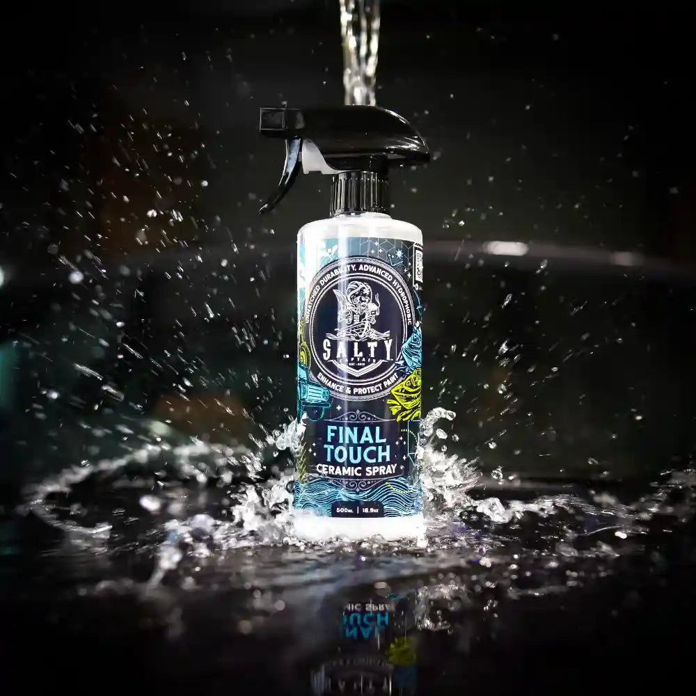 Bottle of Stally Final Touch Ceramic Spray with water droplets on a dark background
