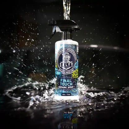 Bottle of Stally Final Touch Ceramic Spray with water droplets on a dark background