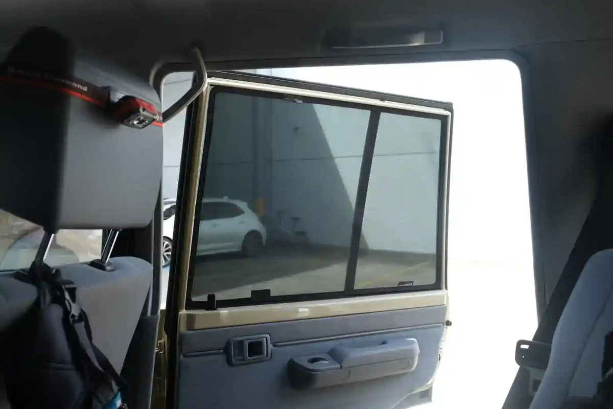 Car interior with a view of a building through the window