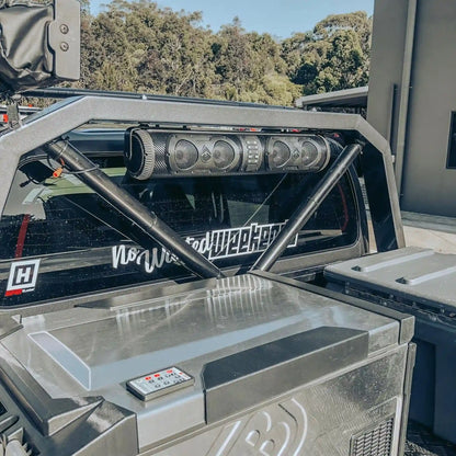 Close-up of a vehicle's open cargo area with visible branding and design elements.