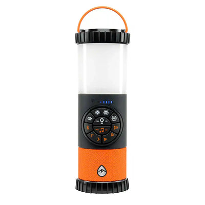 Orange and black portable lantern with speaker on a white background