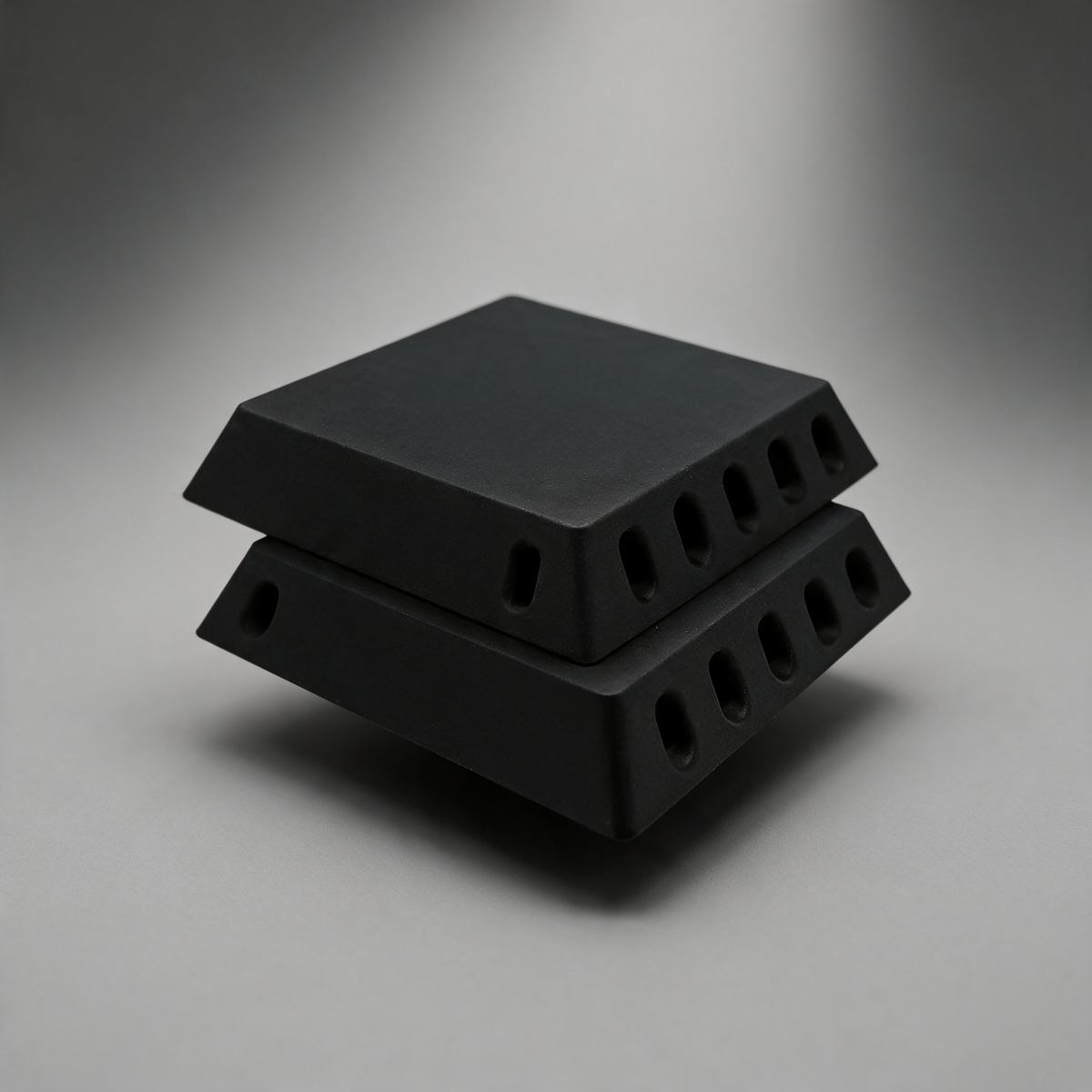 Crossflow directional filtered air vent — matte black ASA carbon-fibre canopy vent on a soft grey studio background
