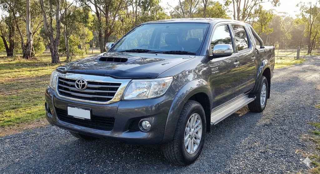 Front view of Charcoal Grey Toyota Hilux N70 SR5 (2013 Model) with OCAM Bonnet Protector installed.