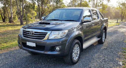 Front view of Charcoal Grey Toyota Hilux N70 SR5 (2013 Model) with OCAM Bonnet Protector installed.