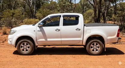 Side profile of White Toyota Hilux N70 SR5 Dual Cab (2008 Model) with OCAM weather shields installed.