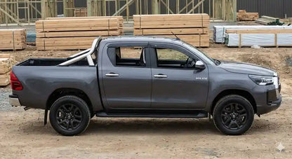 Side profile of Graphite Grey Toyota Hilux N80 SR5 Dual Cab with OCAM weather shields installed.