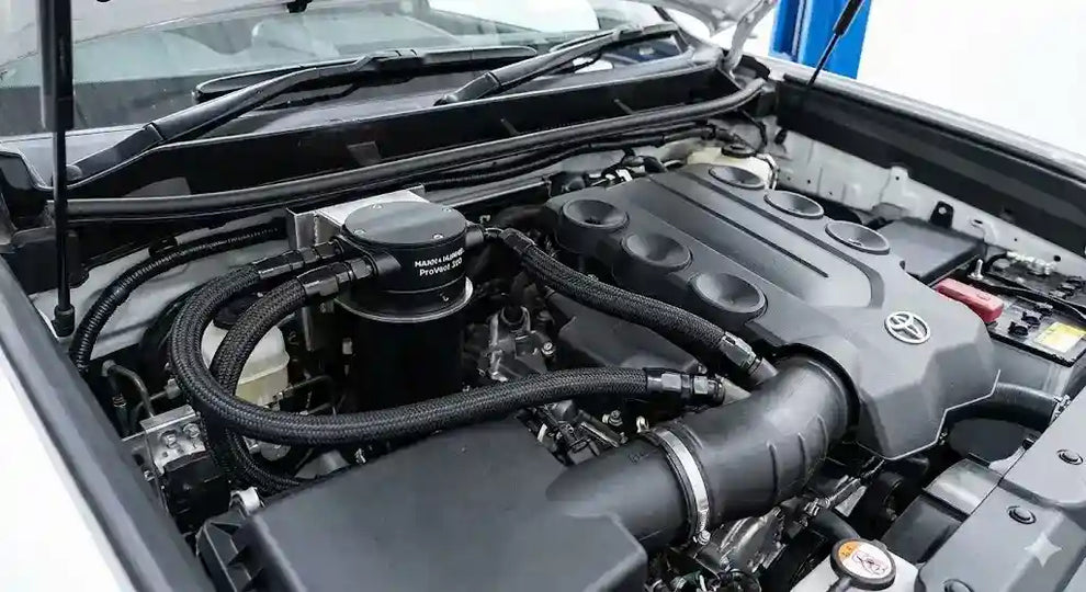 Prado 150 Engine Protection Prado 150 engine bay with ProVent catch can and Direction Plus fuel manager installed