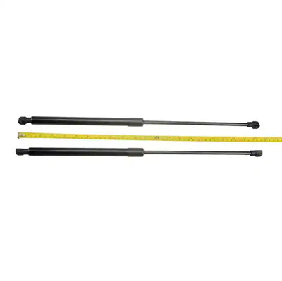 Two black Bonnet Struts with a yellow measuring tape for scale on a white background