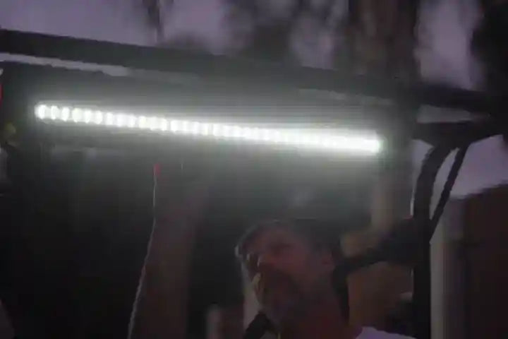 Person holding a large SoundExtreme SE26 bar in a dark setting