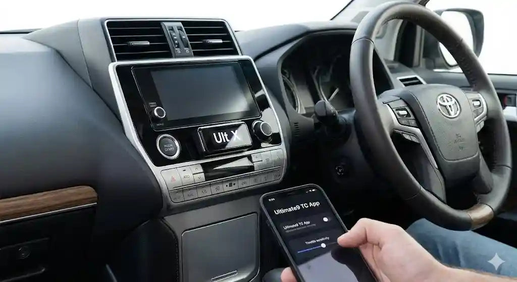 Interior of Toyota Prado 150 Series Kakadu showing Ultimate9 evcX Throttle Controller and Smartphone App.